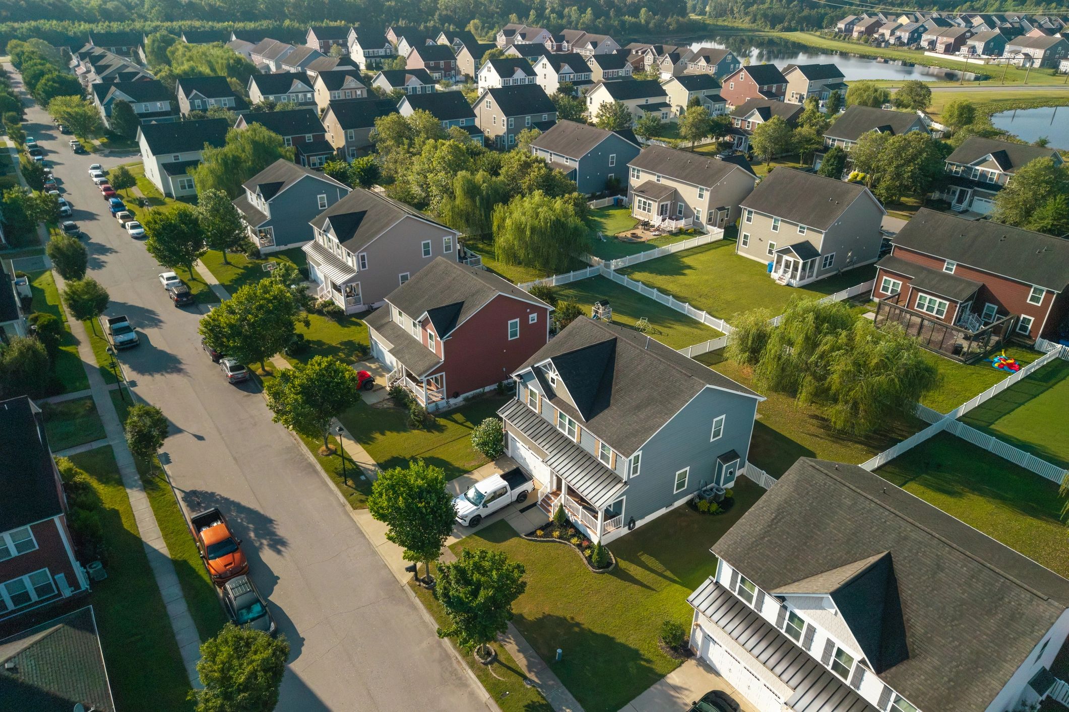 Aerial view of suburban homes with asphalt shingle roofs